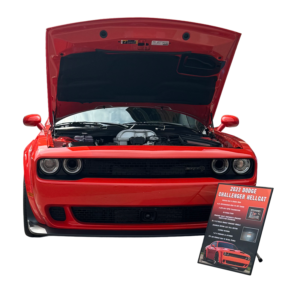 Classic car with Legacy Show Board displayed in front at a car show